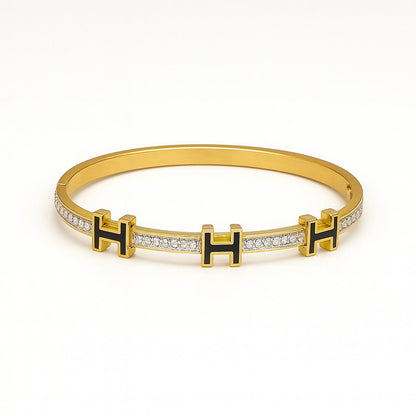 Luxury Gold-Plated “H” Designer Bangle with Black Enamel & Micro-Stone Detailing